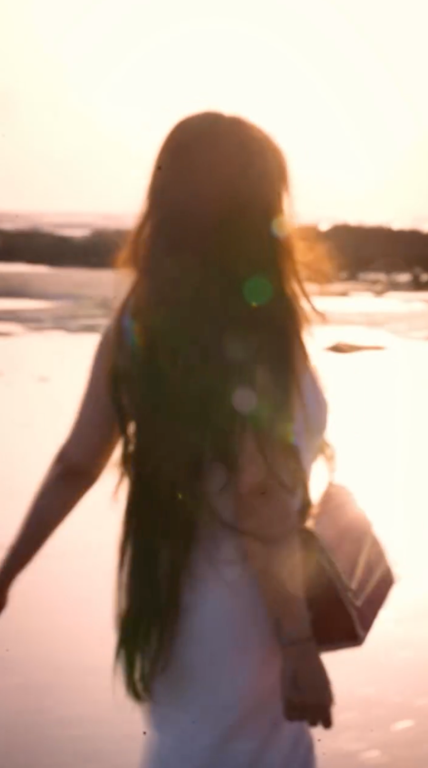 Lifestyle beach video with terracotta bella hanbag by kula. Made from coconut plant leather.
